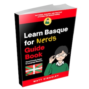 Könnte beinhalten: Ein Taschenbuch mit dem Titel Learn Basque for Nerds Guide Book von Matt Kingsley. Der schwarze Einband hat rote Akzente, eine Zeichentrickfigur, die ihre Brille zurechtrückt, den Text Patterns, Phrases, and Practice Systems for Basque Nerds und eine baskische Flagge.