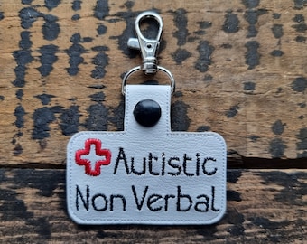 Llavero de alerta médica no verbal para autistas: llavero bordado de piel sintética