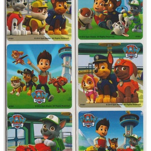 May include: A sheet of stickers featuring characters from the cartoon show Paw Patrol. The stickers feature the characters Chase, Marshall, Skye, Rocky, Zuma, and Rubble. The stickers are all in different poses and have the Paw Patrol logo on them. The stickers are on a white background.