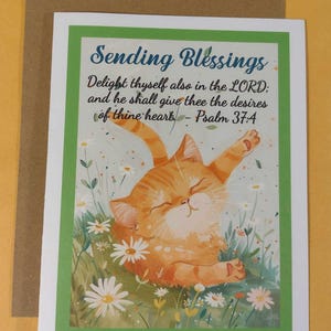 May include: A greeting card with a green border and a cute orange cat illustration. The card features the text "Sending Blessings" and a bible verse: "Delight thyself also in the LORD: and he shall give thee the desires of thine heart - Psalm 37:4".