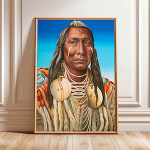 May include: Framed portrait of a Native American man against a blue sky. The man has long dark hair, white face markings, shell earrings, and beaded necklaces. His clothing displays colourful patterns.