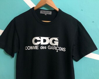 COMME DES GARCONS x Good Design Shop T Shirt Big Logo Medium Size Made in Japan With Nice Used Condition!!! COMME DES GARCONS x Good Design Shop T Shirt Big Logo Medium Size Made in Japan With Nice Used Condition!!!