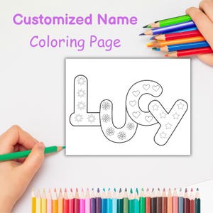 May include: A white coloring page featuring the name "Lucy" in outlined letters, adorned with suns, flowers, hearts, and stars. The text "Customized Name Coloring Page" is above. A hand holds a green pencil, with other coloured pencils visible.