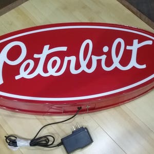 Peterbilt round lighted sign 23x9x2 inches deep
