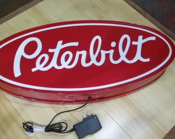 Peterbilt round lighted sign 23x9x2 inches deep