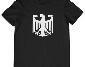 May include: Black t-shirt with a white silhouette of the German eagle.