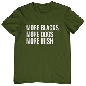 May include: A green t-shirt with the text "More Blacks More Dogs More Irish" printed in white.