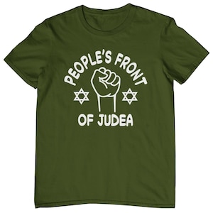 May include: A green t-shirt with a white graphic that says "People's Front of Judea" with a fist and two Star of David symbols.