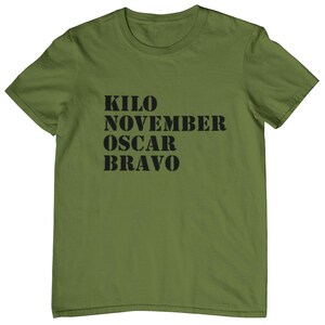 May include: A green t-shirt with the text "KILO NOVEMBER OSCAR BRAVO" printed in black.