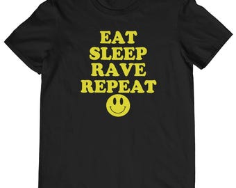 May include: Black t-shirt with yellow text that reads "Eat Sleep Rave Repeat" and a yellow smiley face.