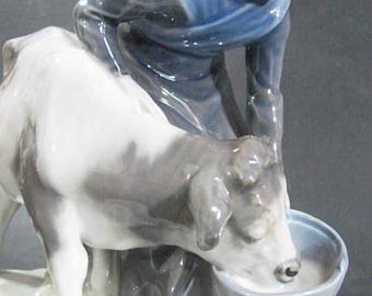 Royal Copenhagen Woman Feeding Cow, Porcelain, #779, Designed by
