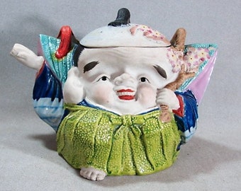 Figural Japanese Banko Teapot, Unusual Form of Smiling Man or Boy with Prunus Branch, Elaborate Robe, ca 1910