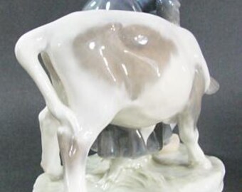 Royal Copenhagen Woman Feeding Cow, Porcelain, #779, Designed by