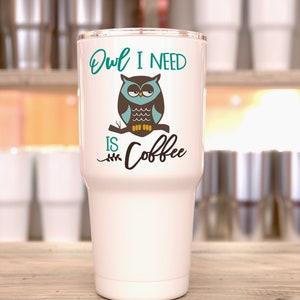 May include: White stainless steel tumbler with a teal, brown, and yellow owl graphic and the text "Owl I need is coffee".