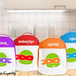 May include: Four colorful lunch bags with white personalized names and Teenage Mutant Ninja Turtles graphics. The bags are purple, red, orange, and blue.