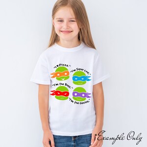 May include: White t-shirt with a graphic of four Teenage Mutant Ninja Turtles heads. Each head has a different colored mask and a quote: "I &hearts; Pizza", "I'm the Boss", "I'm Super Cool", and "I'm the Genius".