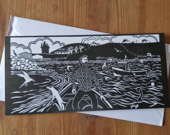 Blank card featuring a paper cut design of a man and terrier in a boat.