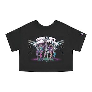 May include: Black cropped t-shirt featuring a graphic of five women in costumes with the text "Ghouls Just Wanna Have Fun" in pink and purple lettering.