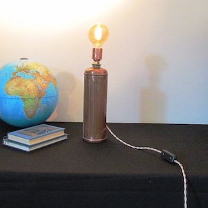 Vintage copper lamp hot water bottle old object recycled and diverted