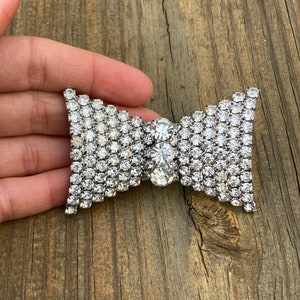 Vintage Clear Rhinestone Bow Tie Shaped Brooch with Curved Sides and Silver Toned Metal #3612