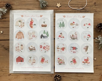 May include: Two sheets of stickers featuring a winter theme with illustrations of animals, plants, and holiday objects. The stickers are round and have a white background with a red border. The text "Nettle And Twig" appears at the top of each sheet.