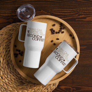 May include: Two white travel mugs with black text and brown coffee bean icons. The text on the mugs reads "I've had one coffee yes, but what about second coffee?"