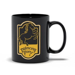 May include: Black ceramic mug featuring a gold design of a prancing horse and the words "Prancing Pony".