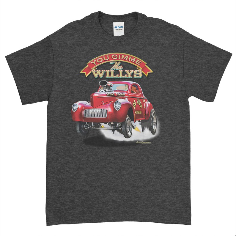 May include: A dark grey t-shirt with a red 1947 Willys hot rod illustration. The car is in mid-air with smoke coming from the tires. The text "You Gimme The Willys" is above the car in a red banner.