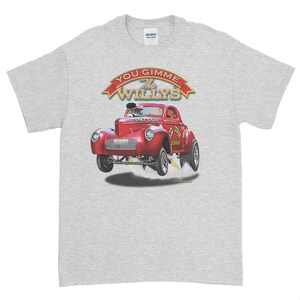 May include: A grey t-shirt with a red 1947 Ford Coupe hot rod illustration. The car is in mid-air with smoke coming from the rear tires. The text "You Gimme The Willys" is above the car in a red banner.