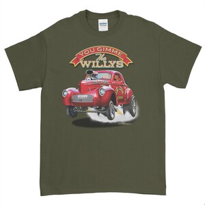 May include: A green t-shirt with a red 1947 Willy's Coupe hot rod illustration. The car is in mid-air with smoke coming from the tires. The text "You Gimme The Willys" is above the car in a red banner.
