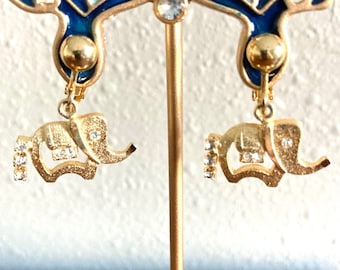 Vintage gold tone clear crystal elephant clip on earrings.