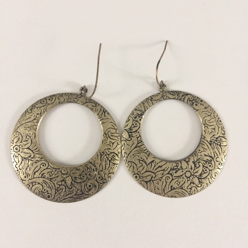 Damascene style brass floral hoop earrings.