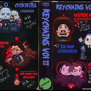 May include: A set of 2.5 inch clear acrylic keychains featuring characters from horror movies. The keychains are designed in a chibi style and include characters like Ash Williams from Evil Dead, the Wicker Man, and Stu and Billy from Scream. The keychains are attached to a black background with text that says "Keychains Vol II" and "Horror".
