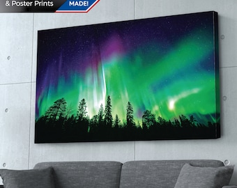 May include: A canvas print featuring a vibrant depiction of the Aurora Borealis. The artwork showcases a colorful display of green, purple, and blue lights dancing across a starry night sky above a silhouetted forest. The text "USA MADE!" is visible.