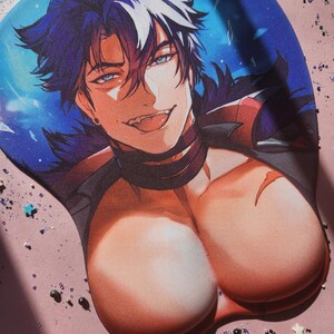 May include: A 3D mouse pad featuring an anime-style character with dark hair, blue eyes, and a smirk. The character has a prominent chest area designed as a wrist rest, with a blue and black background featuring scattered star-shaped accents.
