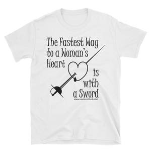May include: White t-shirt with black text that reads "The Fastest Way to a Woman's Heart is with a Sword" and a graphic of a heart being pierced by a sword.