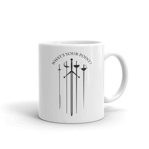 May include: White ceramic mug with a black design of five swords and the text "What's Your Point?"