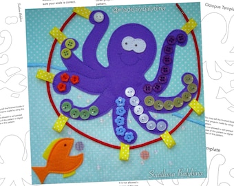 May include: A purple felt octopus with eight tentacles, each with a row of colorful buttons. The octopus is on a blue background with white polka dots. There is a red string attached to the octopus and a yellow felt fish with an open mouth.