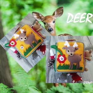 May include: A yellow, green and brown crocheted baby toy shaped like a book with a deer on the front cover. The book has a red flower, a green leaf and a yellow button on the front cover. The text "DEER" is written in black letters on a white background above the book.