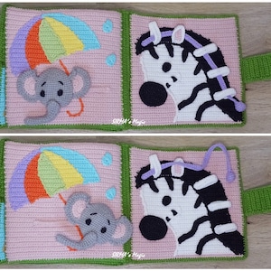 May include: A pink and green fabric book with a rainbow umbrella, a zebra, and an elephant. The book has a purple string attached to the zebra and a grey string attached to the elephant. The book is made of crocheted fabric.