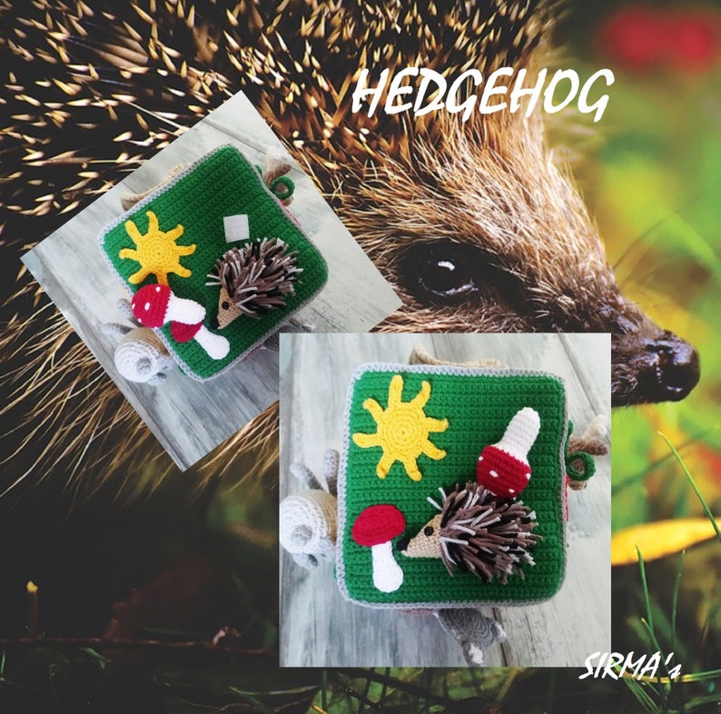 May include: A green and grey crocheted square with a hedgehog, mushroom, and sun design. The text "HEDGEHOG" is written in white letters on a brown background. The text "SIRMA's" is written in white letters on a brown background.