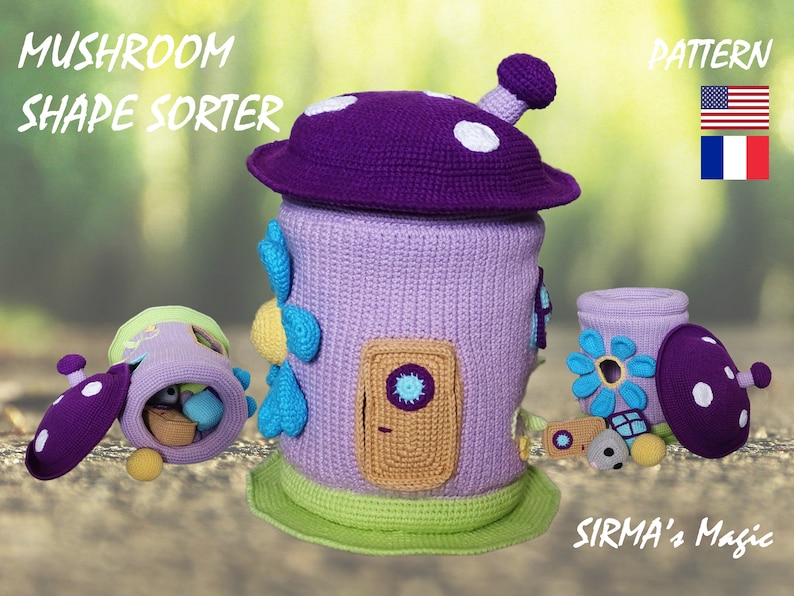 May include: A crocheted mushroom-shaped toy with a removable lid and a door. The toy is a shape sorter with different colored shapes that fit into the holes. The toy is made in purple, green, blue, and yellow yarn. The toy is labeled "Mushroom Shape Sorter" and "Sirma's Magic".