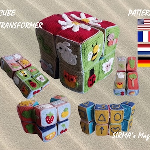 Puede incluir: Un conjunto de bloques de crochet coloridos con varios diseños de animales y naturaleza. Los bloques se pueden ensamblar en un cubo o usar individualmente. La imagen también incluye un patrón para los bloques, disponible en inglés, francés, alemán y holandés.