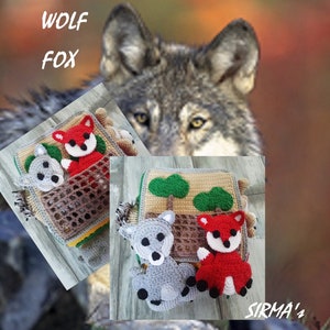 May include: A crocheted baby toy featuring a wolf, fox and bear design. The toy has various textures and colours, including brown, grey, red and green. The toy is labelled "SIRMA's".