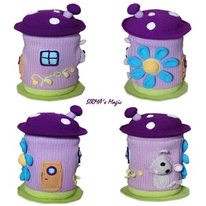 May include: A purple crocheted mushroom-shaped toy storage bin with a flower, a door, and a window. The bin has a green base and white polka dots on the top.