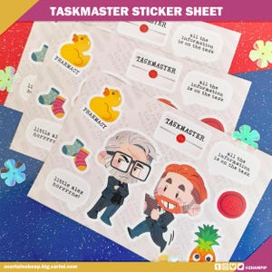 May include: A sheet of stickers featuring cartoon illustrations and text. The stickers include images of a rubber duck, socks, and characters with the text "TASKMASTER", "PHARMACY", and speech bubbles with the text "all the information is on the task".
