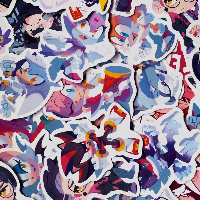 May include: A collection of colorful stickers featuring various cartoon characters. The stickers showcase a variety of designs with vibrant colors, including shades of blue, purple, red, and white. The stickers are of different sizes and shapes.