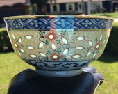 Exquisitely decorated and gold embellished quot rice grain quot porcelain bowl with lotus motif, red, green, gold and blue, Chinese, rice eyes