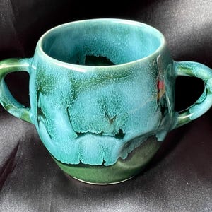 May include: A rustic wooden sign with the text "Welcome to our home" in white lettering. The sign features a distressed finish and a simple, inviting design, perfect for a front porch or entryway.