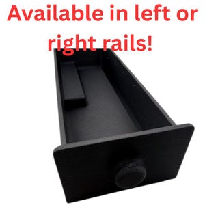 May include: Black drawer with a rounded knob. The drawer has a rectangular shape with a recessed area inside. Text at the top reads "Available in left or right rails!"